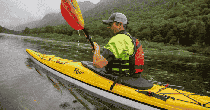 ken whiting kayaking with an nrs dry top aquabound paddle and nrs pdf in the water in quebec