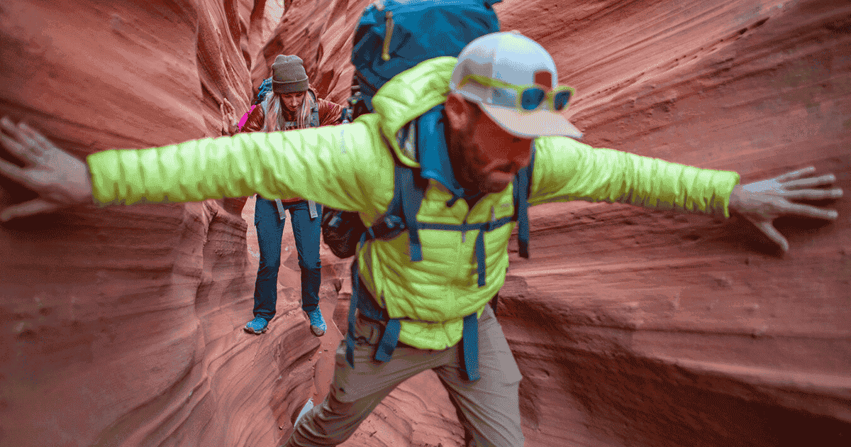 eric going through rocks in utah backpacking and hiking