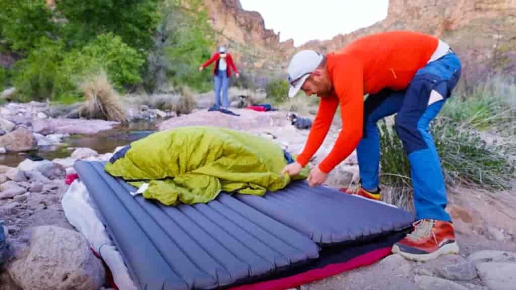 Zenbivy Light Double Camping Bed setup: Step 1, cover your two sleeping mats with the first layer.