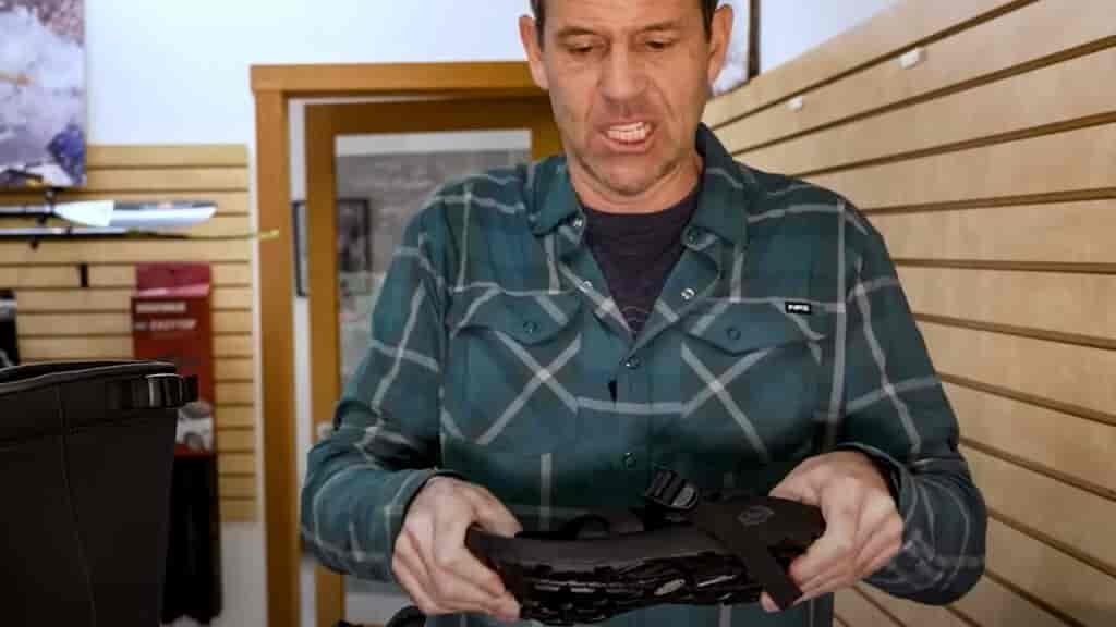 A kayak boot or kayaking shoe work tend to work better than sandals.