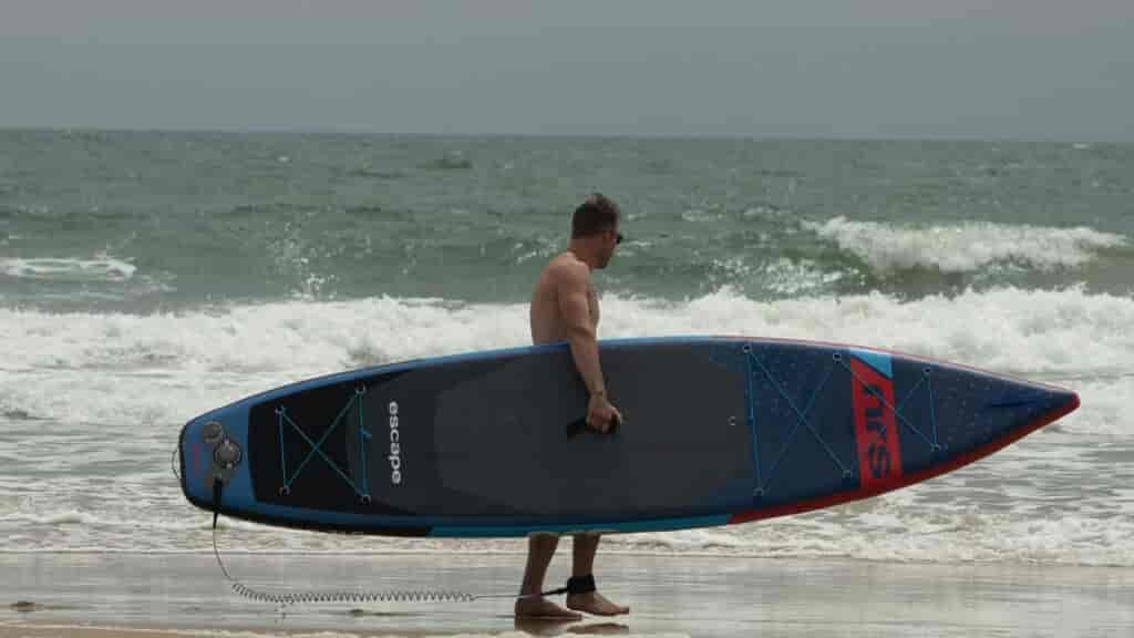 Nick slips off to surf it up while I do some home schooling, mental health of parents is important, and exercise helps