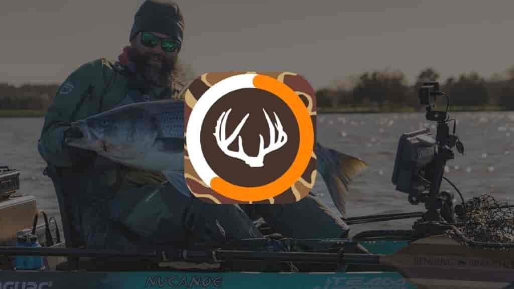 jameson on boat holding caught fish isolunar app